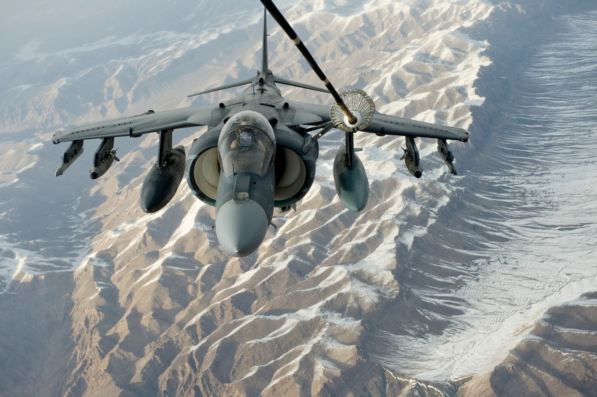 A U.S. Marine Corps A/V-8B Harrier receives fuel over Afghanistan from a KC-10 Extender from the 908th Expeditionary Air Refueling Squadron, Feb. 24, 2012. The 908th EARS provides critical air refueling to aircraft in the area of responsibility, delivering more than one million gallons of fuel to the fight every day. In 2011, the 908th EARS offloaded more than 390 million pounds of fuel to more than 28,000 aircraft, flew more than 36,700 hours in almost 4,600 missions. The average sortie length for a KC-10 mission in Southwest Asia is about eight hours. (U.S. Air Force photo by Staff Sgt. Greg C. Biondo)