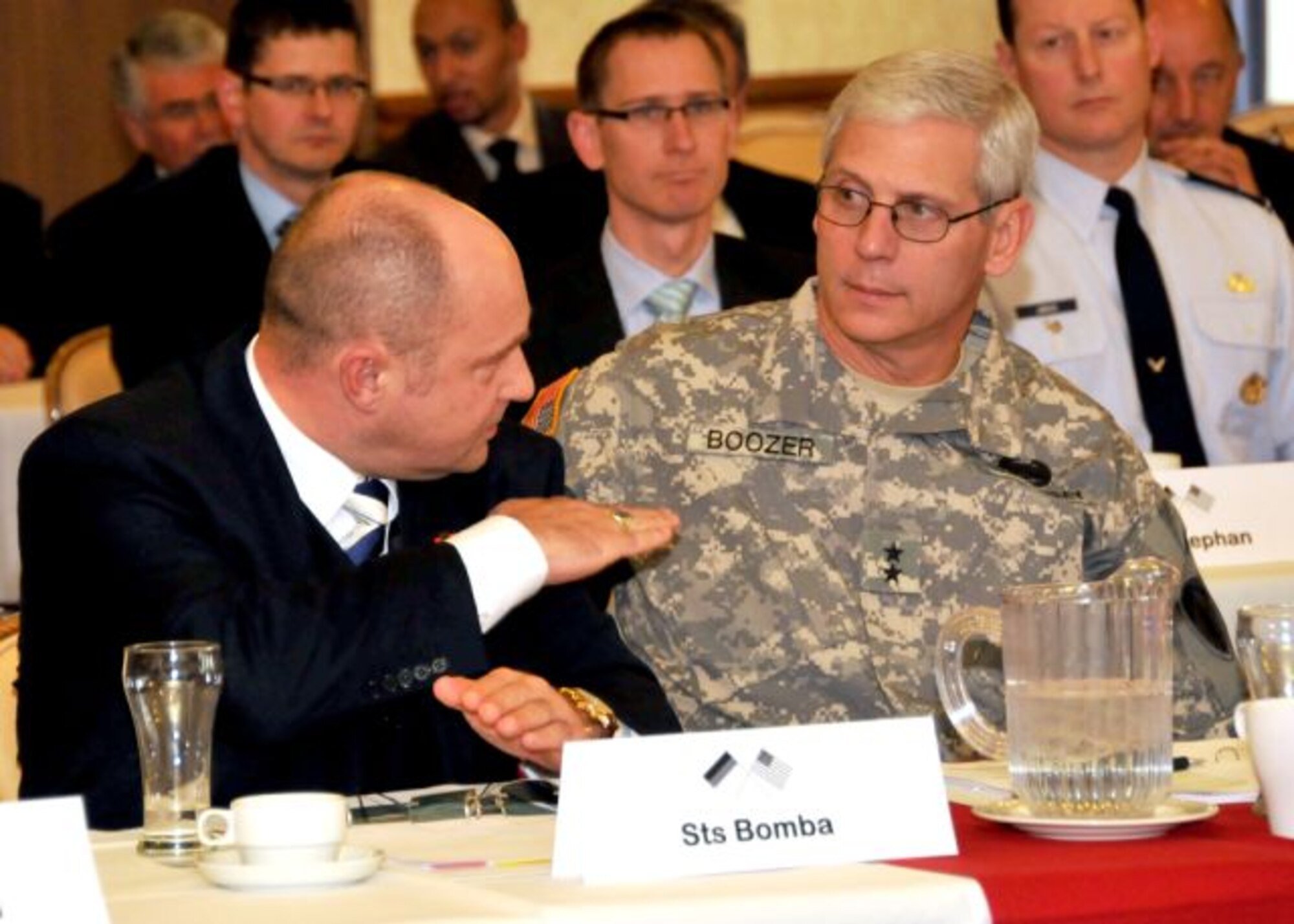 German Undersecretary Rainer Bomba, German Federal Ministry for Traffic and Construction, and Major Gen. James Boozer, and U.S. Army Europe deputy commanding general, share some thoughts during a meeting about the proposed new KMC Medical Facility at the Armstrong Club, Vogelweh Air Base, Germany Feb. 27, 2012. (U.S. Air Force photo/Tech. Sgt. Markus M. Maier)(Released)