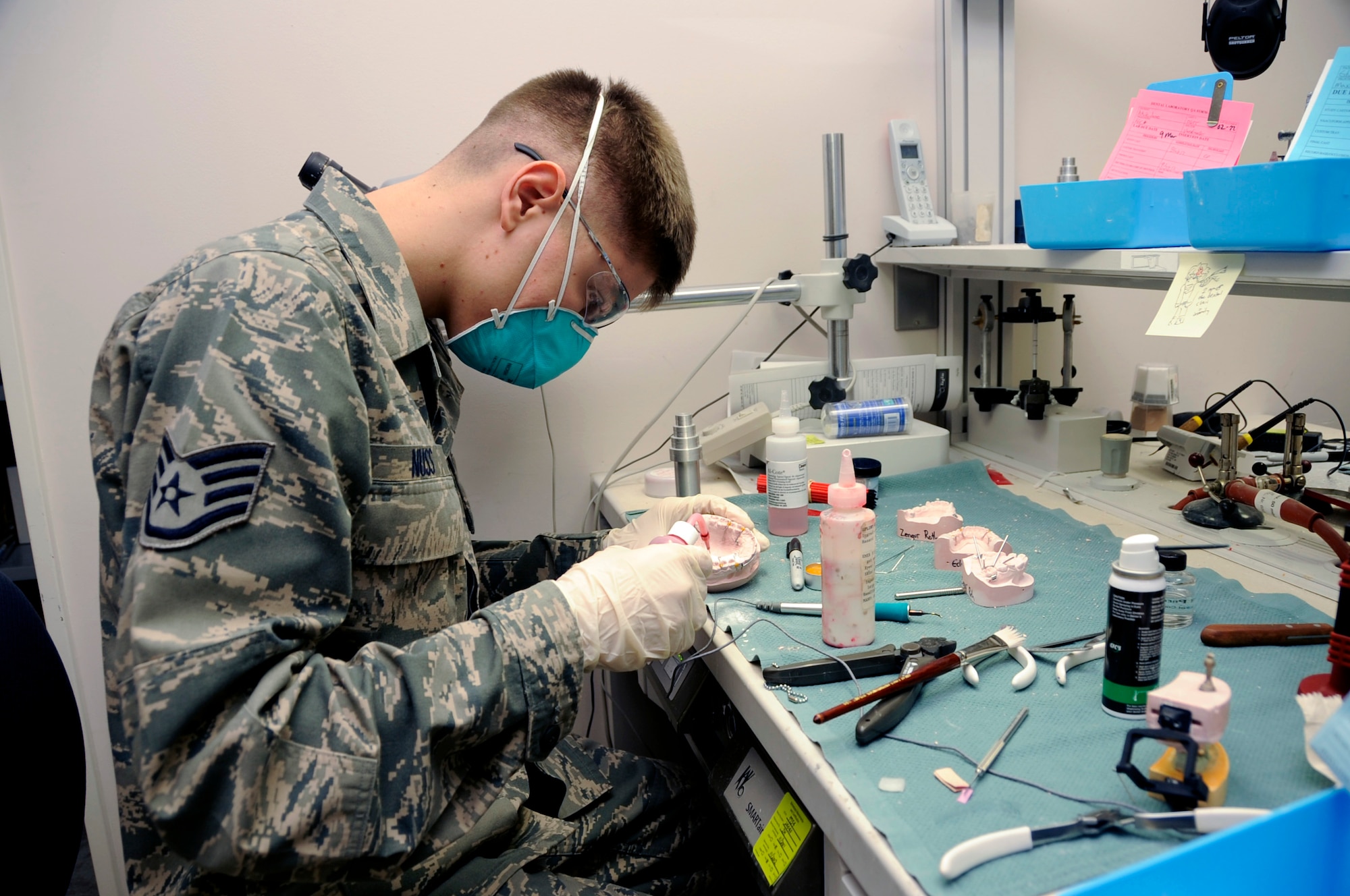 U.S. Air Force Staff Sgt. Dustin Nuss, 35th Dental Squadron dental lab technician, keeps retainer wires in place by using an acrylic mold on a dental impression at Misawa Air Base, Japan, Feb. 24, 2012. Dental lab technicians also make other dental prosthetics, such as gold, ceramic and porcelain crowns. (U.S. Air Force photo by Airman 1st Class Kaleb Snay/Released)