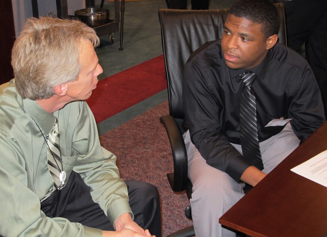 HUTSVILLE, Alabama — Bryant Marshburn (left), U.S. Army Corps of Engineers Huntsville Center engineering directorate, discusses education and career planning with Alabama A & M student Michael Wallace during an informal mentoring session Feb. 24, 2012.