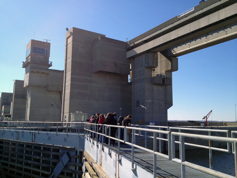 ALTON, Ill. — STEM students gather on top of the miter gates at the U.S. Army Corps of Engineer's Melvin Price Locks and Dam to learn about lock operations during the Saturday Scholars program Feb. 25, 2012. St. Louis District employees engaged students from 18 high schools in Southwestern Illinois during the event. 