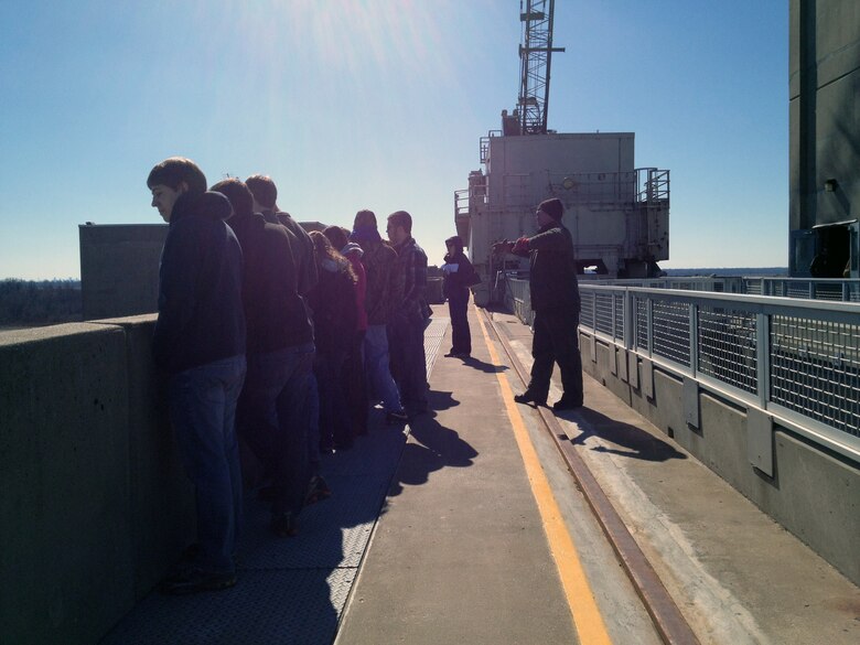 ALTON, Ill. — Brandon Beckemeyer, park ranger with the U.S. Army Corps of Engineers St. Louis District, talks with STEM students about barge traffic at the U.S. Army Corps of Engineer's Melvin Price Locks and Dam here, during the Saturday Scholars program Feb. 25, 2012. Every year, more than 8,000 vessels and over 60 million tons of cargo pass through Melvin Price Locks and Dam.