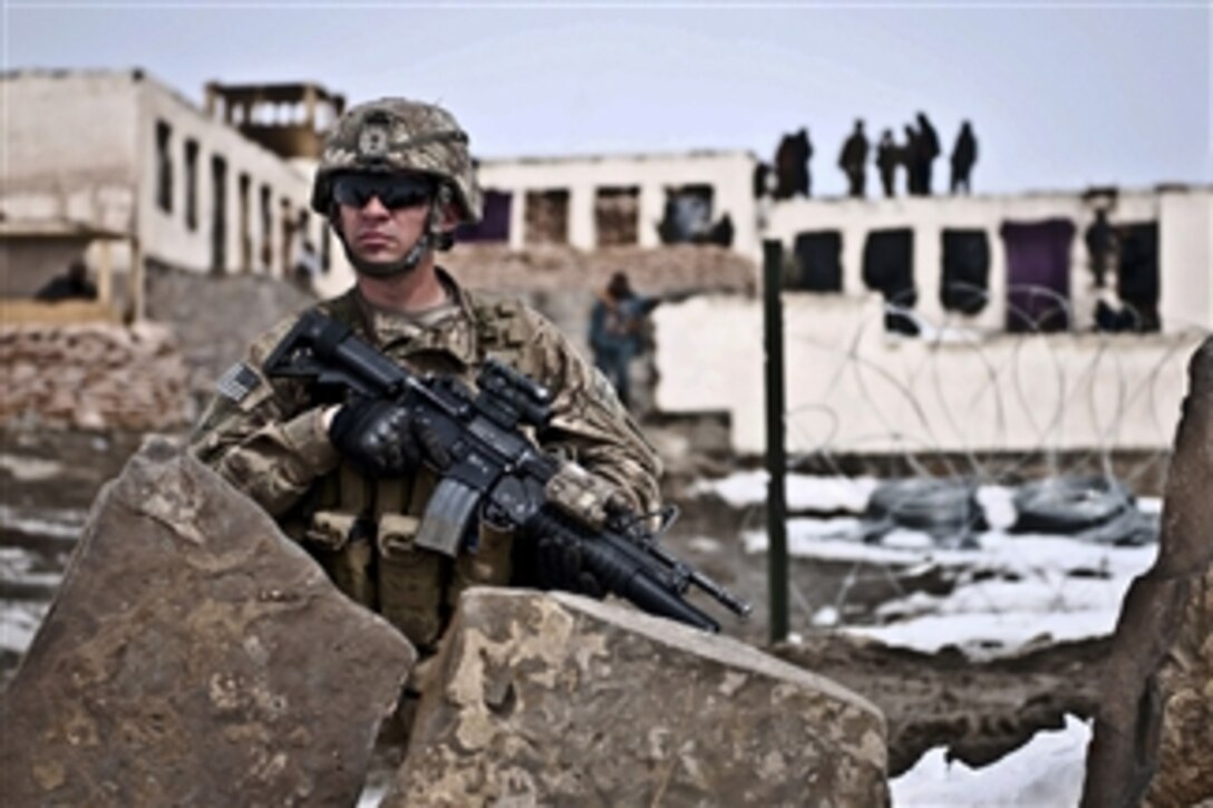 U.S. Army Pvt. Anthony McCarthy keeps watch outside an Afghan local police checkpoint in Marzak village in Afghanistan's Paktika province on Feb. 26, 2012.  DoD photo by Staff Sgt. Charles Crail, U.S. Army.  (Released)