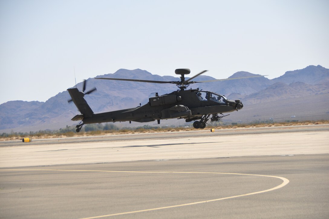 The next generation combat helicopter, the Apache Block III, seems to leap off the runway at the Barstow-Daggett Army Airfield during a shakeout flight Feb. 29. The Army is testing the combat capabilities of the Apache at the nearby National Training Center and parking the lethal birds at the airfield. The soldiers from Fort Riley, Kan., conducting the real world testing are eating at the Marine Corps Logistics Base Barstow Family Restaurant for the next 90 days.