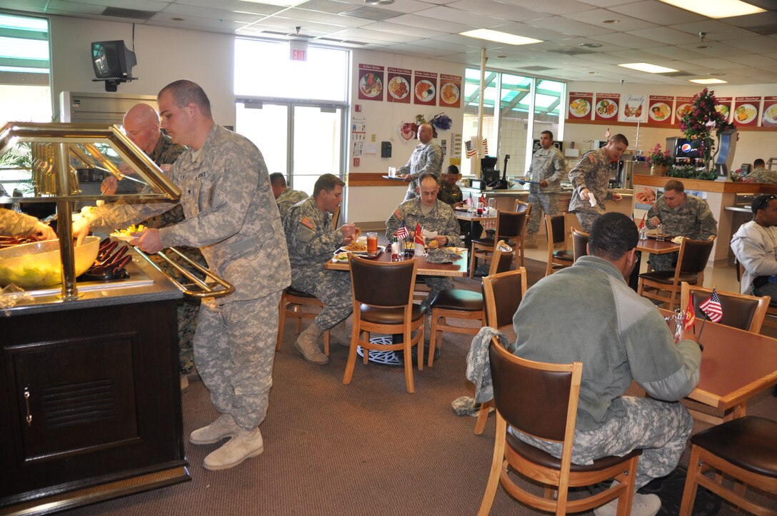 Soldiers from the 1st Battalion, 1st Combat Aviation Brigade, Fort Riley, Kan., use the Family Restaurant aboard Marine Corps Logistics Base Barstow as their dining facility while working at the Barstow-Daggett Army Airfield, Feb. 29. The Army unit is getting logistical support from the Marines in the form of three hot meals a day while they run the Attack Helicopter 64 Apache Block III through its paces at the National Training Center.
