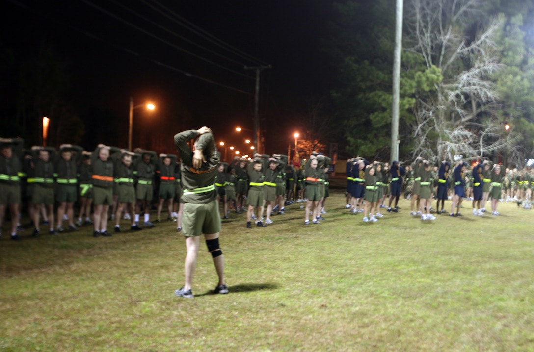 Marines and sailors of Combat Logistics Regiment 27, 2nd Marine Logistics Group stretch before beginning their motivational run aboard Camp Lejeune, N.C., Feb. 24, 2012. Maj. Gen. Michael G. Dana, the 2nd MLG commanding general, led the Marines and sailors on a run through the streets of Camp Lejeune before speaking to them and thanking them for a job well-done over the past year. 