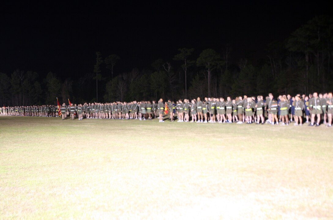 Marines and sailors of 2nd Marine Logistics Group stand in formation waiting to begin their motivational run aboard Camp Lejeune, N.C., Feb. 24, 2012. Maj. Gen. Michael G. Dana, the 2nd MLG commanding general, led the Marines and sailors on a run through the streets of Camp Lejeune before speaking to them and thanking them for a job well-done over the past year. 