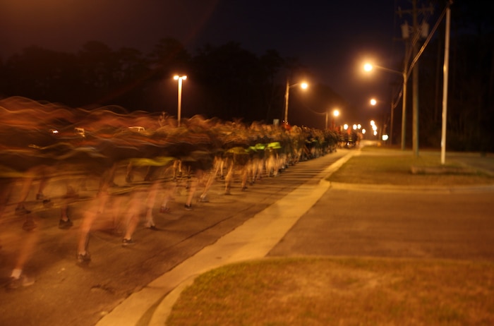 Marines and sailors of 2nd Marine Logistics Group flood the streets of Camp Lejeune, N.C., Feb. 24, 2012, during a motivational run. Maj. Gen. Michael G. Dana, the 2nd MLG commanding general, led the Marines and sailors on a run before speaking to them and thanking them for a job well-done over the past year. 