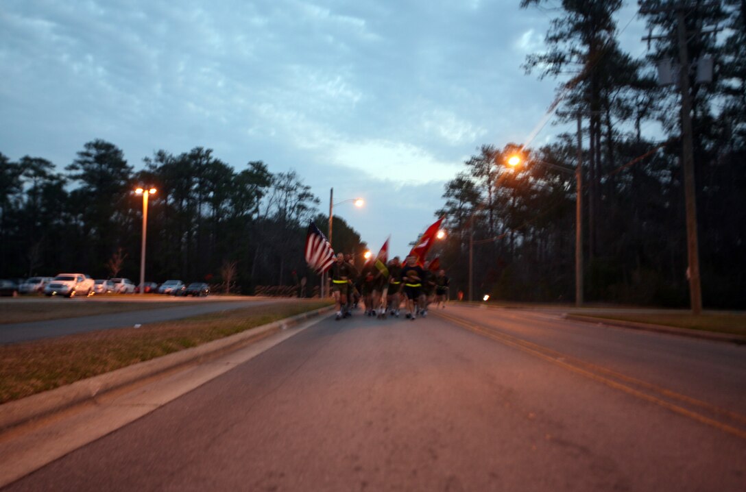 The 2nd Marine Logistics Group command leads more than 700 Marines and sailors on a motivational run through the streets of Camp Lejeune, N.C., Feb. 24, 2012.  Maj. Gen. Michael G. Dana, the 2nd MLG commanding general, took time after the run to thank the Marines and sailors for a job well-done over the past year. 