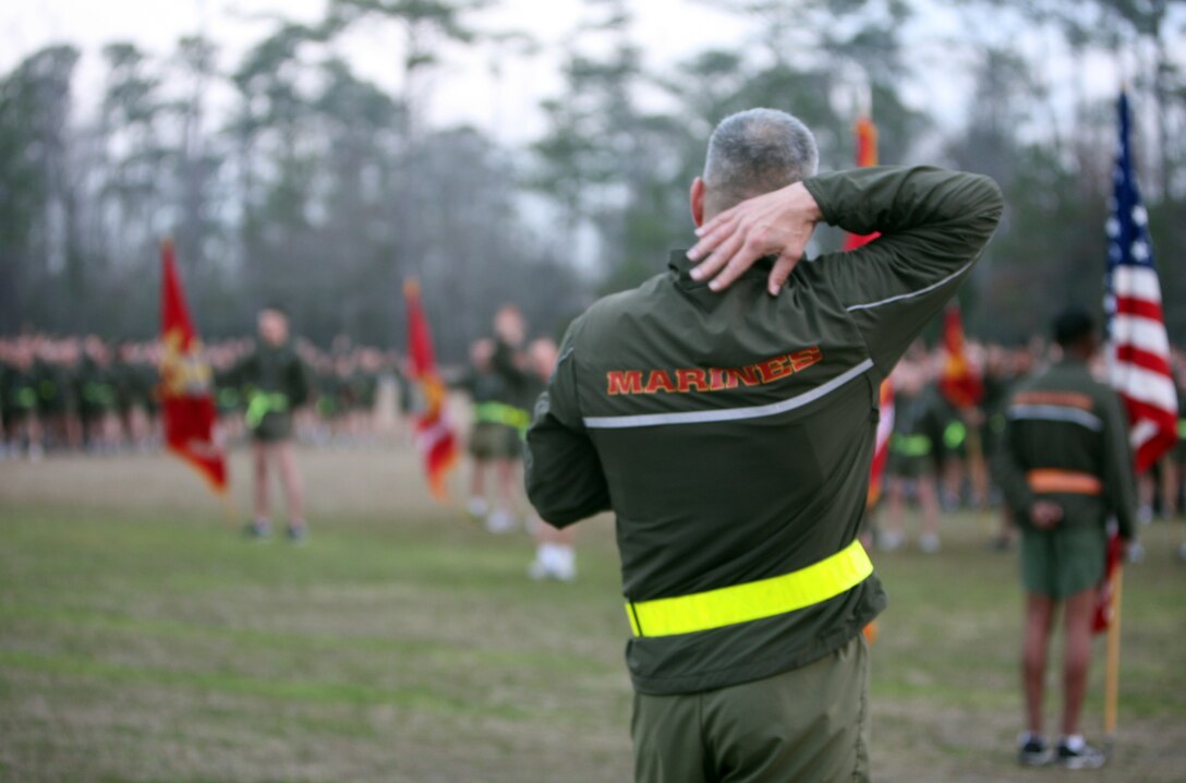 Maj. Gen. Michael G. Dana, the 2nd Marine Logistics Group commanding general, pats himself on the back while speaking to the Marines and sailors of the 2nd MLG after a run aboard Camp Lejeune, N.C., Feb. 24, 2012. Dana spoke to the Marines and sailors after the motivational run and instructed every Marine or sailor “to pat themselves on their backs” for a job well-done over the past year. 