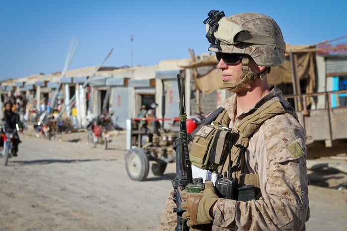 Second Lt. Andrew McGann, the assistant team leader of Team 3, Civil Affairs Detachment 11-2, patrols though a bazaar in Khan Neshin, Afghanistan, Feb. 29, 2012. Under the leadership of McGann, a 26-year-old native of Longmont, Colo., the Marines of Team 3 are improving Khan Neshin by helping the local community service their own country through projects contracted to locals.