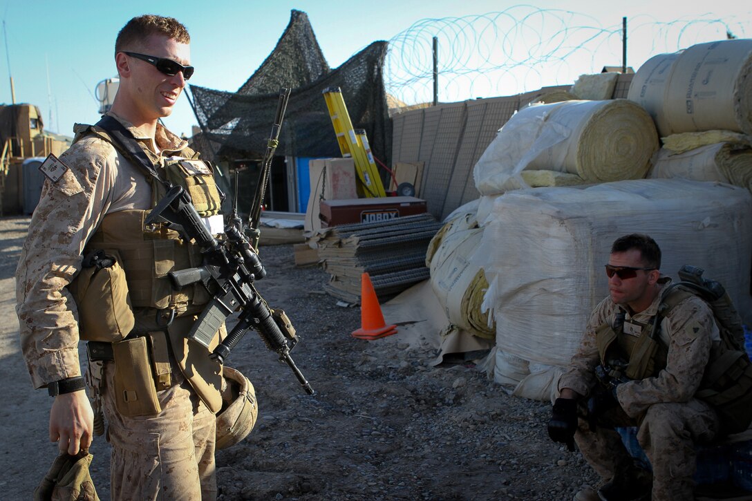 Second Lt. Andrew McGann, the assistant team leader of Team 3, Civil Affairs Detachment 11-2, debriefs his Marines after a patrol that served as a site survey to civil affairs projects in Kahn Neshin, Afghanistan, Feb. 29, 2012. Under the leadership of McGann, a 26-year-old native of Longmont, Colo., the Marines of Team 3 are improving Khan Neshin by helping the local community service their own country through projects contracted to locals.