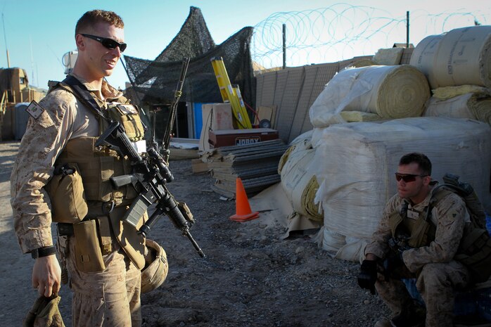 Second Lt. Andrew McGann, the assistant team leader of Team 3, Civil Affairs Detachment 11-2, debriefs his Marines after a patrol that served as a site survey to civil affairs projects in Kahn Neshin, Afghanistan, Feb. 29, 2012. Under the leadership of McGann, a 26-year-old native of Longmont, Colo., the Marines of Team 3 are improving Khan Neshin by helping the local community service their own country through projects contracted to locals.