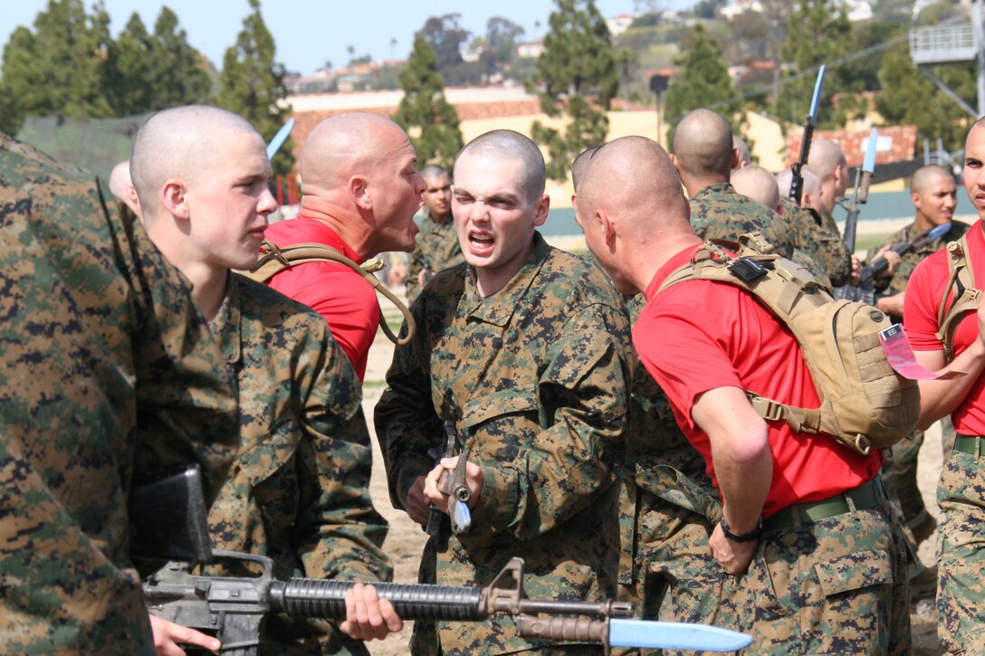 Drill Instructors help recruits from Company B., 1st Recruit Training Battalion with bayonet techniques as part of the Marine Corps Martial Arts program Feb. 29 aboard Marine Corps Recruit Depot San Diego. Recruits of Co. B. are in week two of Recruit Training.