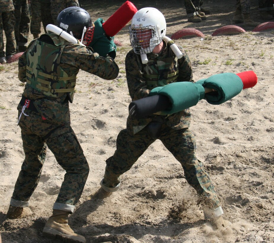 Recruits of Company B, 1st Recruit Training Battalion, execute bayonet techniques with pugil sticks against each other as part of the Marine Corps Martial Arts Program training Feb. 29 aboard Marine Corps Recruit Depot San Diego. The recruits use the pugil sticks as a training weapon to utilize the bayonet techniques they just learned.