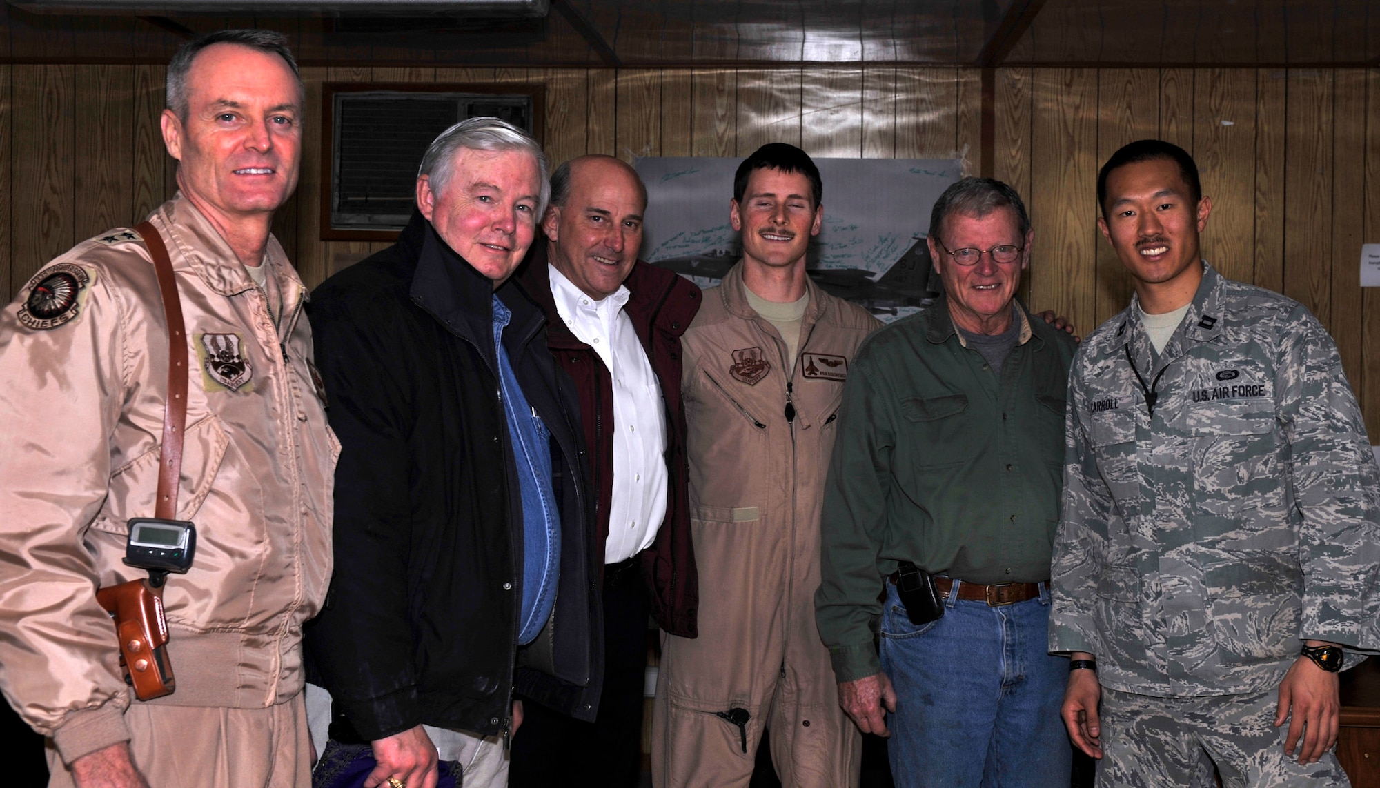 BAGRAM AIRFIELD, Afghanistan— Texas representatives Joe Barton and Louie Gohmert and Oklahoma senator James Inhofe, a senior member of the Senate Armed Services Committee, pose with Maj. Gen. Darryl Roberson, 455th Expeditionary Wing commander, and two members of the 335th Expeditionary Fighter Squadron during their tour of Bagram Airfield, Afghanistan, Jan 1, 2012. The Senator also visited the air traffic control tower and Craig Joint Theater Hospital. (U.S. Air Force photo/ Airman 1st Class Ericka Engblom)