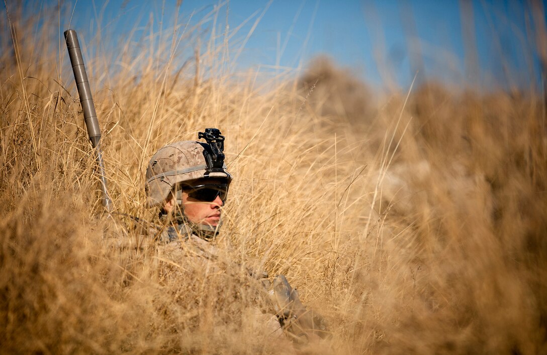 A Marine from 2nd Platoon, Alpha Company, 9th Engineer Support Battalion, 2nd Marine Logistics Group (Forward), uses a metal detector to sweep a culvert during a route reconnaissance mission of Route Red, which extends from Highway 1 to Shir Ghazay, Jan. 2.  The purpose of the mission was to document inclines and declines in the route, sharpness of curves, the shortest width during the route, and where culverts were located or needed to be placed on the route to prevent wash out.