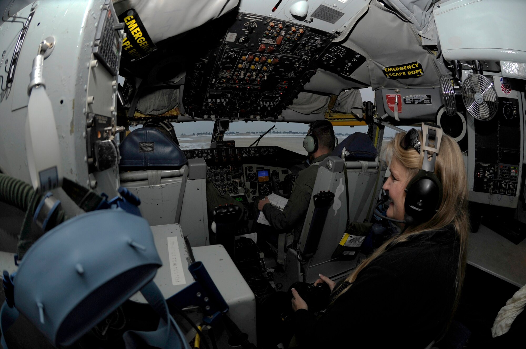 Lorelei Hinsvark, wife of Lt. Col. Brian Hinsvark, 8th Mission Support Group deputy commander, watches as pilots of the 909th Air Refueling Squadron from Kadena Air Base, Japan, prepare for takeoff Dec. 28, 2011 at Kunsan Air Base, Republic of Korea. As part of a joint effort between the 80th Fighter Squadron and the 909th ARS, military spouses visiting the area were given the opportunity to fly along on the air refueling mission. (U.S. Air Force photo by Senior Airman Jessica Hines/Released)