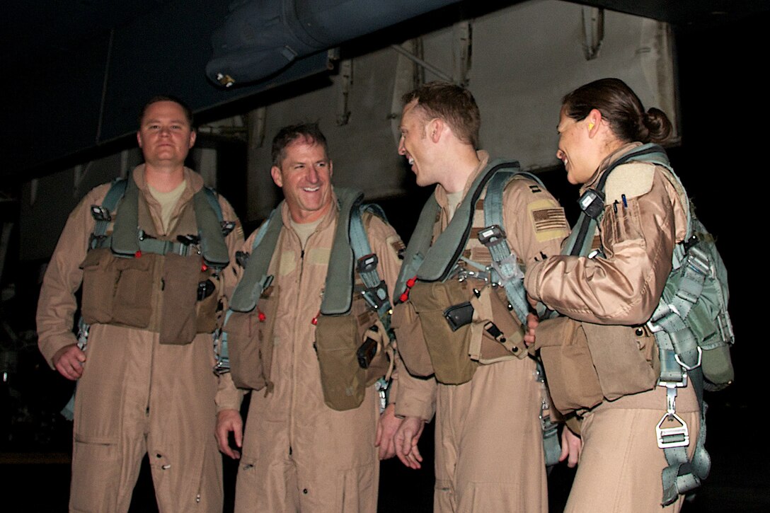 Lt. Gen. David Goldfein (second from left), U.S. Air Forces Central Command commander, shares a laugh with a B-1 Lancer crew after joining them for a sortie here over the holiday season. The crew members, (from left) Capt. Robert Rauch, Capt. Donavon Davis and Capt. Miranda Brasko, are assigned to the 34th Expeditionary Bombing Squadron here and  are deployed from Ellsworth Air Force Base, S.D. The B-1B is a long-range, multi-role bomber that can be used for a variety of operational missions. (courtesy photo)