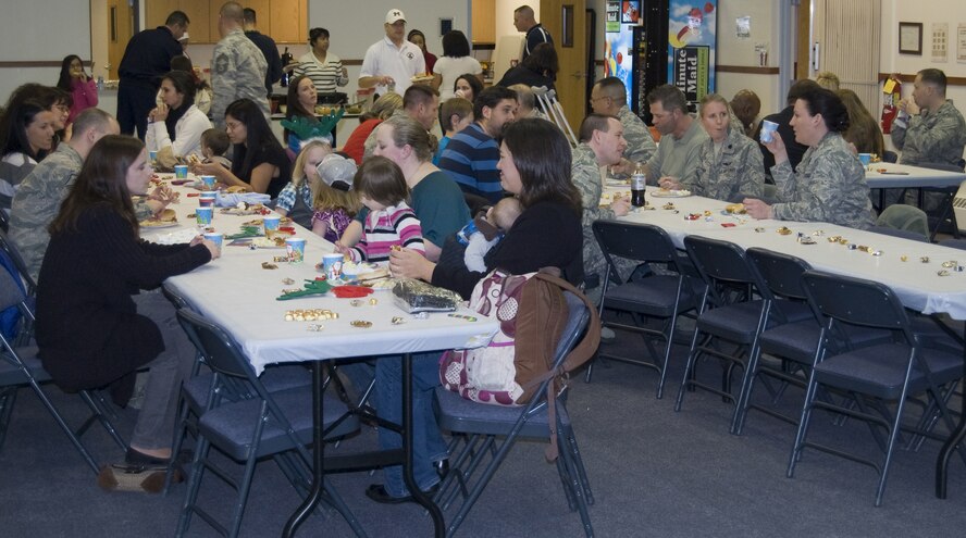 Spouses of deployed Team Malmstrom members enjoy a free meal during the Deployed Spouses' Holiday Party. (U.S. Air Force courtesy photo)