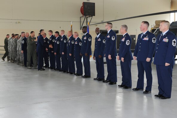 Base leadership congratulates Moody Air Force Base’s newest promotees during a ceremony Dec. 30, 2011. Forty-three Moody Airmen were promoted to the ranks of staff sergeant, technical sergeant, master sergeant, senior master sergeant and chief master sergeant in January. (U.S. Air Force photo by Staff Sgt. Ciara Wymbs/Released)