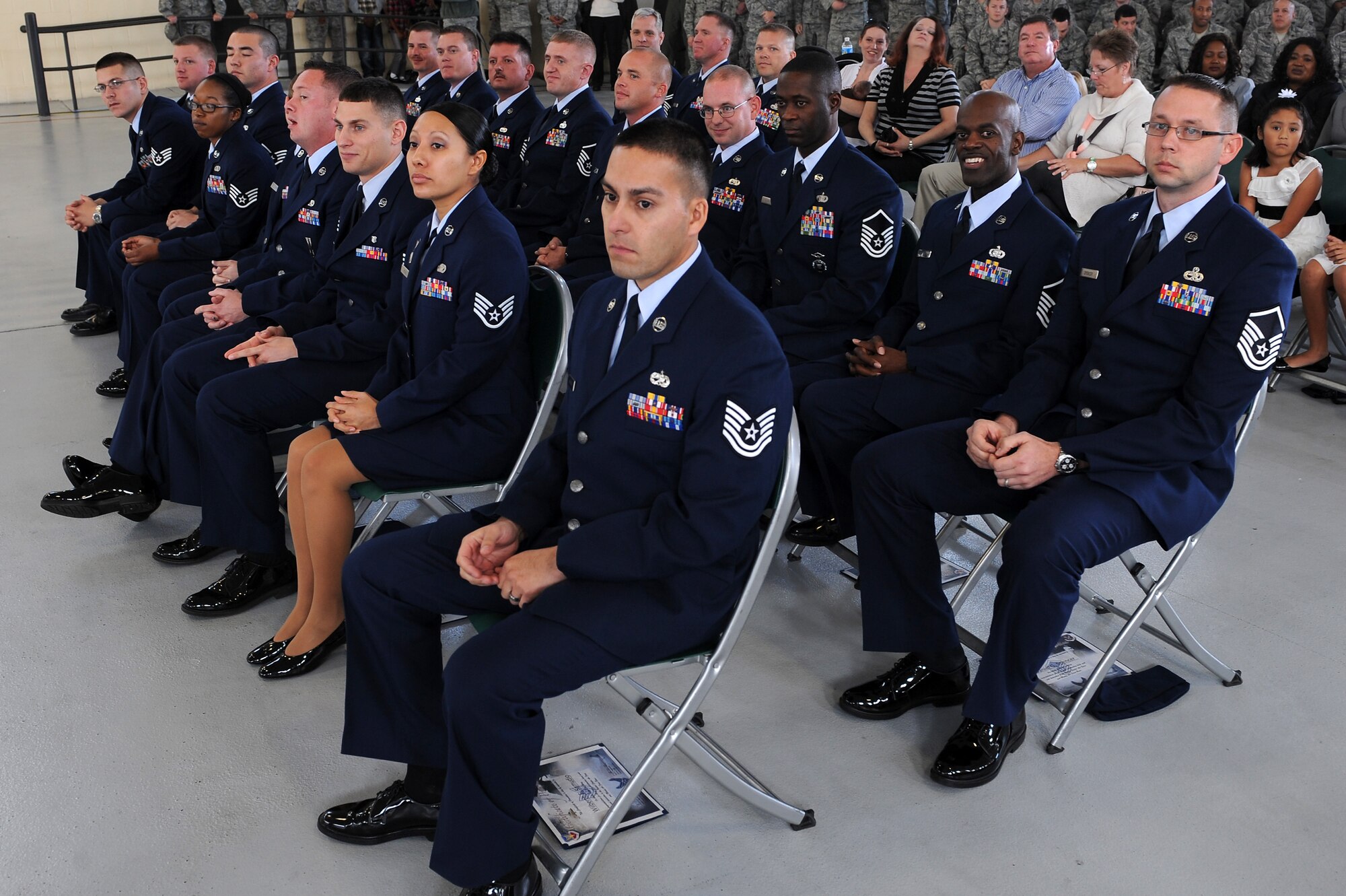 Moody Air Force Base’s newest promotees sit at the conclusion of a promotion ceremony Dec. 30, 2011. Family, friends and co-workers attended to congratulate the Airmen. (U.S. Air Force photo by Staff Sgt. Ciara Wymbs/Released)