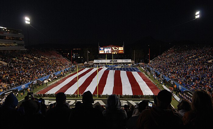 Nellis Air Force Base Airmen participated in the flag ceremony at the MAACO Bowl game Dec. 22, 2011, at Sam Boyd Stadium in Las Vegas, Nev. Approximately 200 service members volunteered to help display the football field-size flag for audience members watching the opening ceremony of the MAACO Bowl.  (U.S Air Force photo by Senior Airman Stephanie Rubi / Released) 