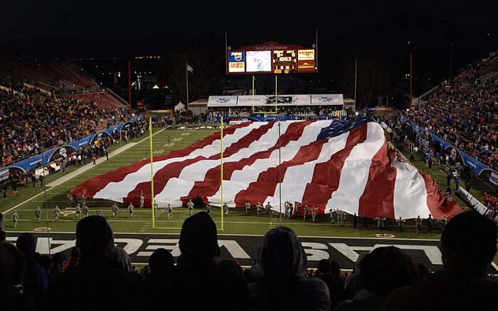 Nellis Air Force Base Airmen participated in the flag ceremony at the MAACO Bowl game Dec. 22, 2011, at Sam Boyd Stadium in Las Vegas, Nev. Approximately 200 service members volunteered to help display the football field-size flag for audience members watching the opening ceremony of the MAACO Bowl.  (U.S Air Force photo by Senior Airman Stephanie Rubi / Released) 