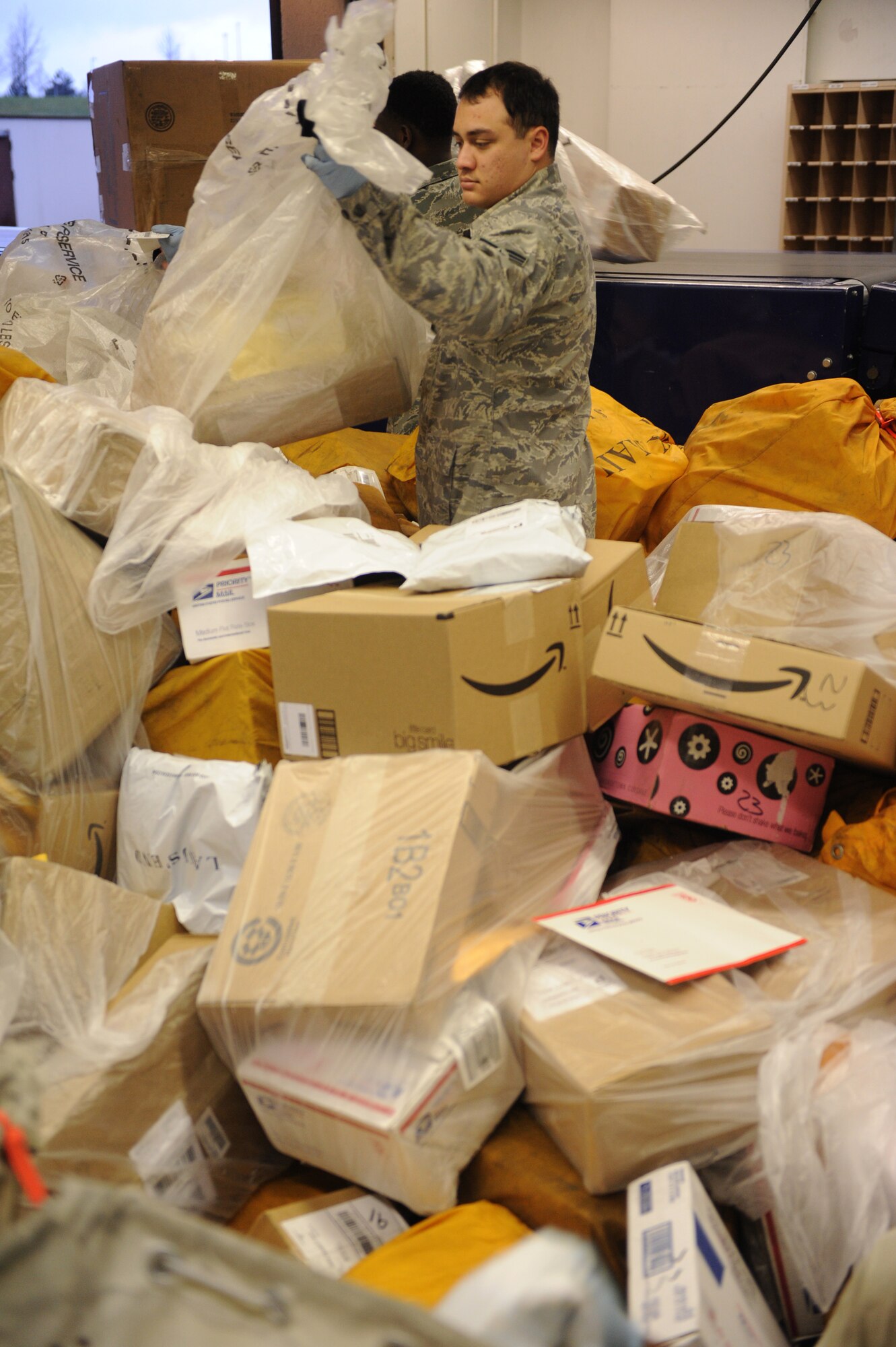 SPANGDAHLEM AIR BASE, Germany – Senior Airman Steven Hyer, 52nd Communication Squadron postal clerk, sorts mail at the Spangdahlem Post Office here Jan. 2. The post office processed 423,000 pounds of inbound mail from Nov. 1 to Dec. 31 to ensure Saber Airmen and their families received their packages for the holiday season. (U.S. Air Force photo/Airman 1st Class Matthew B. Fredericks)