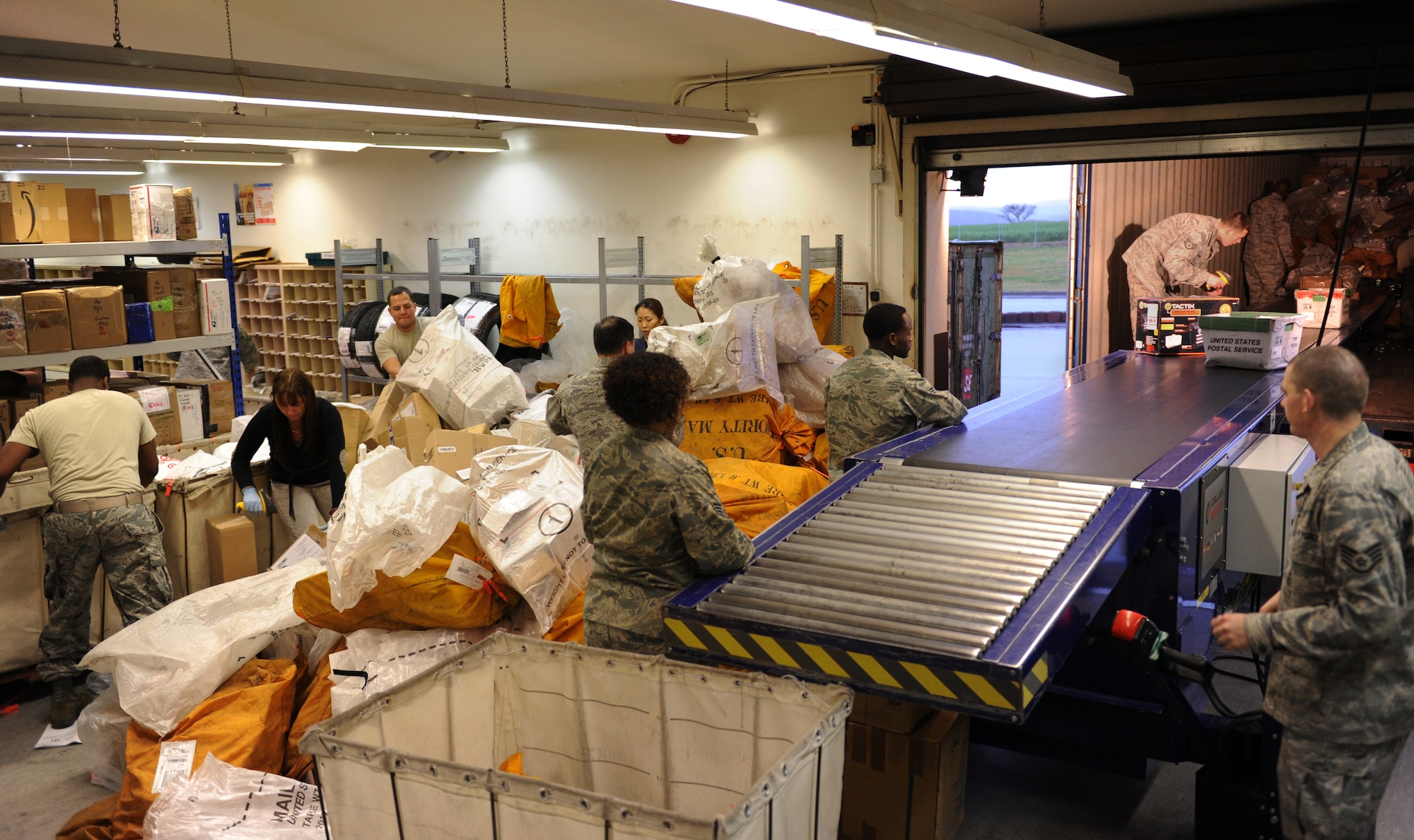 SPANGDAHLEM AIR BASE, Germany – Postal clerks from the 52nd Communication Squadron unload and sort mail from a delivery truck at the Spangdahlem Post Office here Jan. 2. The post office processed 423,000 pounds of inbound mail from Nov. 1 to Dec. 31 to ensure Saber Airmen and their families received their packages for the holiday season. (U.S. Air Force photo/Airman 1st Class Matthew B. Fredericks)