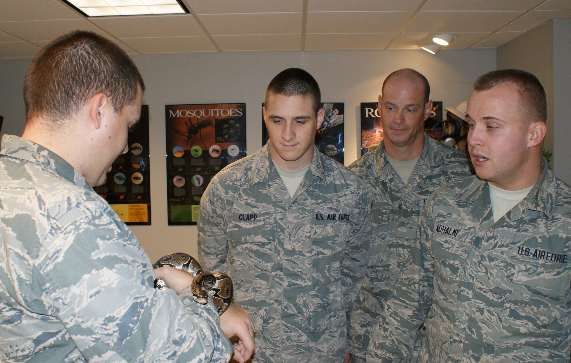 Airmen handle different types of animals, including snakes, during the 366th Training Squadron's  Pest Management Apprentice Course Dec 16, 2011 at Sheppard Air Force Base, Texas.  Students learn pest management missions at both home station and in the contingency environment during the 33 academic days and six major blocks of instruction. (U.S. Air Force photo/Dan Hawkins)