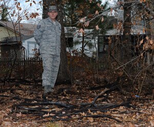 U.S. Air Force Tech. Sgt. Michael Wade, 1st Maintenance Squadron Aerospace Ground Equipment supervisor, stands in the charred remains of a fire he put out on Dec. 7, 2011, near the Kraft Neighborhood Park, in Hampton, Va. Being the first responder to the fire and jumping into action, Wade believed other Air Force members would have done the same, a reflection of the Air Force core value of "service before self." (U.S. Air Force photo by Airman First Class Teresa Cleveland/Released)