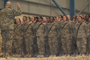 General Raymond T. Odierno, the U.S. Army Chief of Staff, administers the Oath of Reenlistment to approximately 30 Soldiers deployed to Kandahar Airfield, Afghanistan Dec. 21. Seven of the reenlisting Soldiers are assigned to Task Force Resolute. Following the ceremony, Odierno spoke to the crowd of roughly 1,000 Soldiers thanking them for their sacrifice, and continued devotion to our nation. (U.S. Army photo by Spc. Krista Payne
Task Force Resolute Public Affairs)
 

