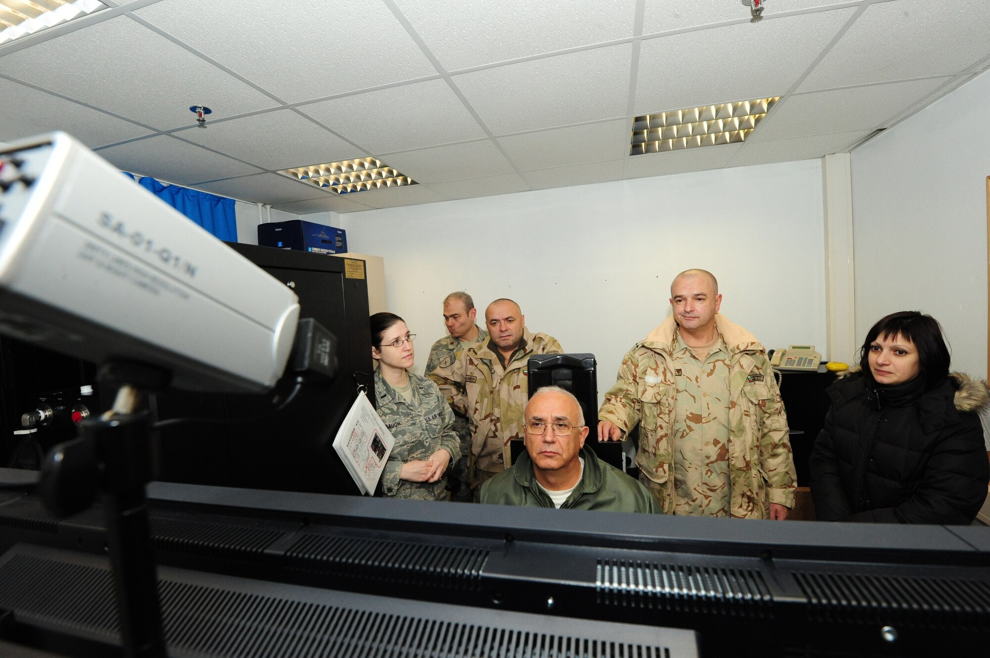 Bulgarian Col. Lyubomir Alexiev, Military Medical Academy doctor, uses the hypoxya familiarization trainer during a visit to Ramstein Air Base, Germany, Dec. 14, 2011. Bulgarian military medical members came to Ramstein to learn how the Contingency Aeromedical Staging Facility personnel move wounded warriors out of the battlefield. (U.S. Air Force photo/Senior Airman Aaron-Forrest Wainwright) 