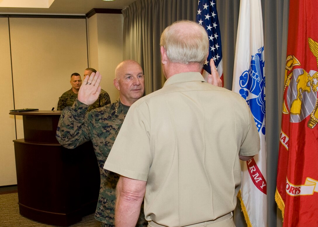 Commander, U.S. Pacific Command Adm. Robert Willard administers the oath of office to the next PACOM deputy commander, Lt. Gen. Thomas Conant following a promotion pinning ceremony here today. Lt. Gen. Conant will be the first U.S. Marine to serve as the deputy commander of the Pacific Command once he assumes those duties as directed.