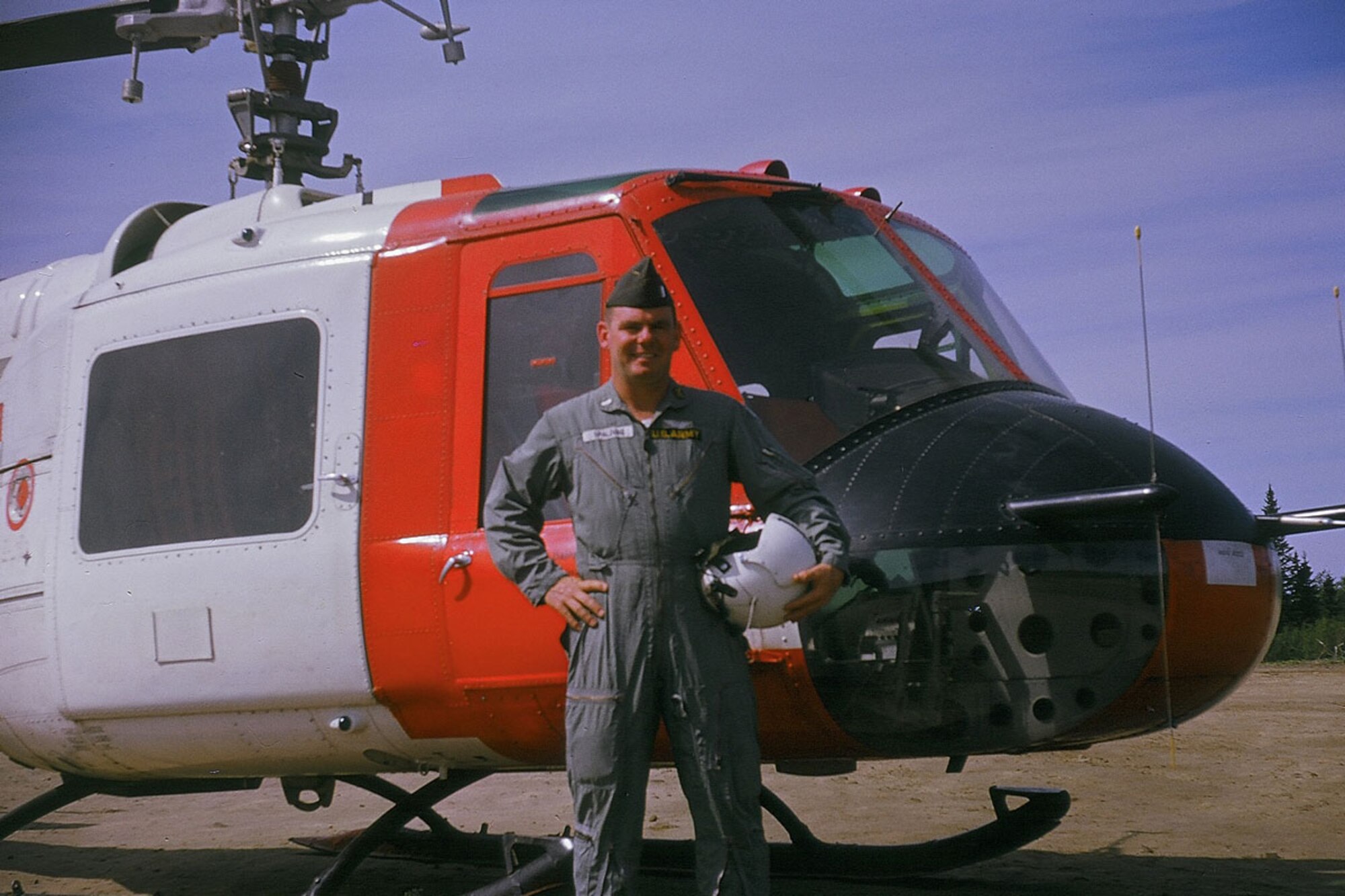 Col. (ret) John Spalding stands in front of a UH-1A on Bryant Army Airfield in 1963. Spalding, the Alaska Army National Guard’s first state aviation officer, flew the UH-21 Shawnee, UH-1A Huey, L-19 Bird Dog, OH-13 Sioux and the U-1A single engine Otter. Photo: Courtesy of Col (ret) John Spalding