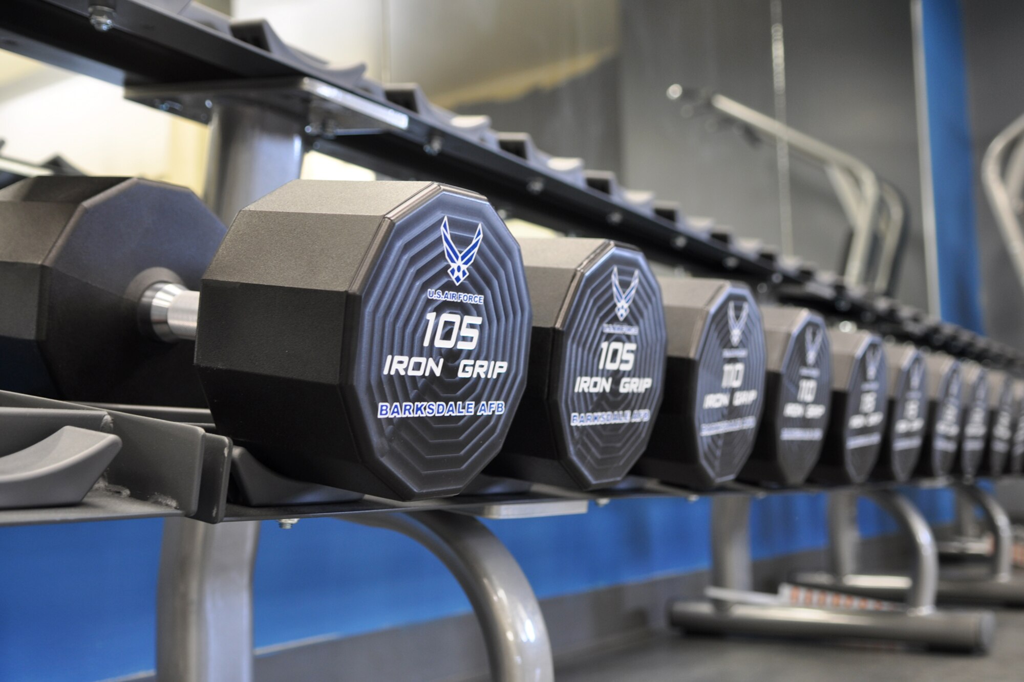 A row of new dumb bells await the opening of the newly remodeled weight room at the Fitness Center on Barksdale Air Force base, La., Jan. 4, 2012. A Re-Grand opening is scheduled for Jan. 9, 2012. More than 2,500 Barksdale Airmen, dependents and retirees utilize the facility every day. (U.S. Air Force photo by Master Sgt. Jeff Walston/Released)