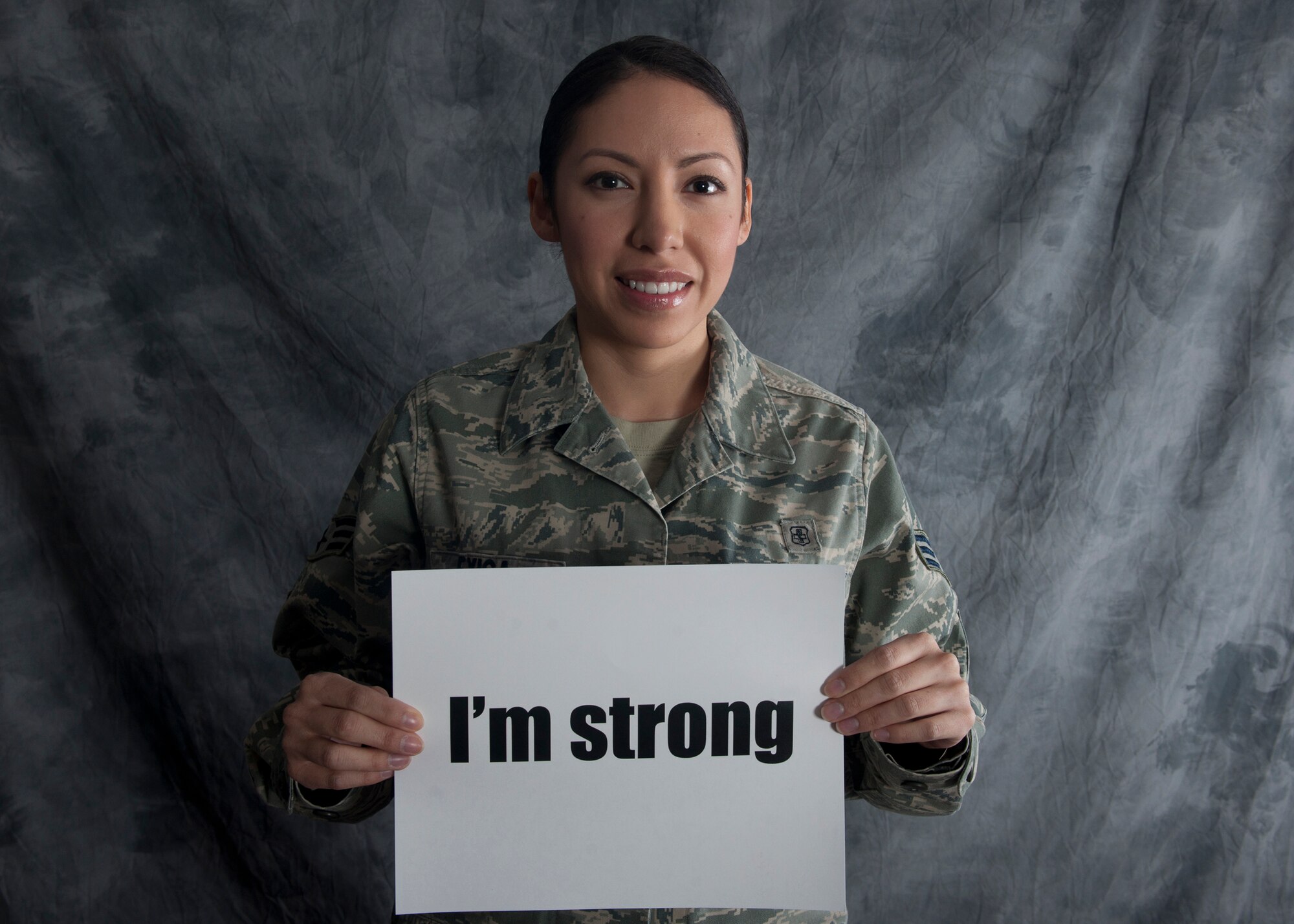 U.S. Air Force Senior Airman Maria Exiga, 23rd Medical Group, poses for a “strong” photo to support Women’s Self-Empowerment Week, Jan. 4, 2011, at Moody Air Force Base Ga. The allotted time from Jan. 5 to 9 is recognized to encourage women to be proud of their accomplishments and the roles they play in society, as well as to set new goals toward personal growth. Exiga feels that being a single parent and pursuing her bachelor’s degree has made her a strong independent woman.  She plans to continue taking small steps to grow and improve in all aspects of her life. (U.S. Air Force photo by Senior Airman Eileen Meier/Released)