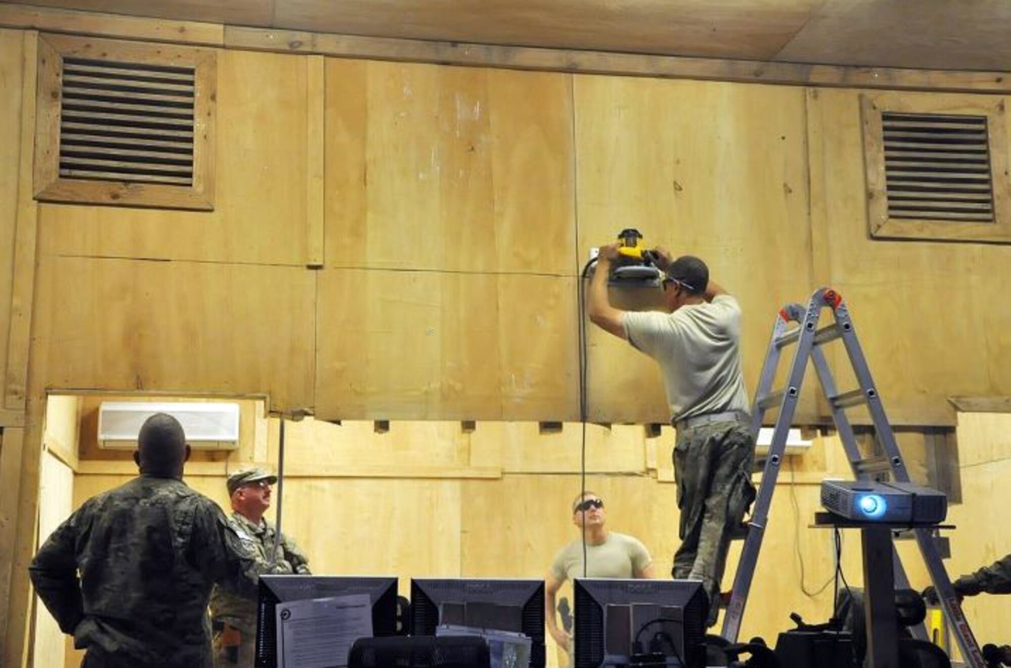 Pittsburgh native Air Force Tech. Sgt. Frank Monacelli, a structures specialist on his second deployment, uses a circular saw to cut a portion of the back wall of the 3rd Brigade Combat Team, 1st Armored Division Joint Operations Center on Forward Operating Base. Monacelli, a veteran of 16 years, has been deployed for the last three months and has traveled throughout Afghanistan increasing the quality of life at smaller combat outposts. (U.S. Army photo/Sgt. John D. Ortiz)