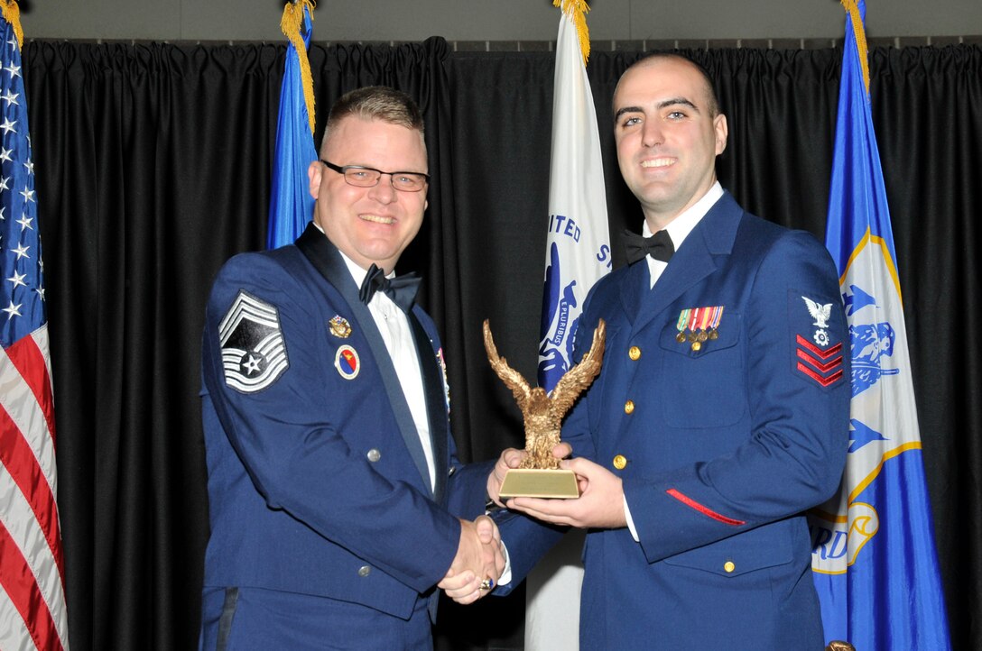 McGHEE TYSON AIR NATIONAL GUARD BASE, Tenn. -- Petty Officer 1st Class Byron Knepp, right, receives the commandant award for NCO Academy Class 11-8 at The I.G. Brown Air National Guard Training and Education Center here from Chief Master Sgt. Donald E. Felch, EPME commandant, Nov. 3, 2011.  The award is presented to the student who made the most significant contribution to the overall success of the class by demonstrating superior leadership abilities and excellent skills as a team member.  It is named in honor of CMSgt Paul H. Lankford, a Bataan Death March survivor and the first commandant of the Air National Guard Enlisted Professional Military Education Center.  (U.S. Air Force photo by Master Sgt. Kurt Skoglund/Released)