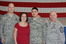 MINOT AIR FORCE BASE, N.D. -- Col. S.L. Davis, 91st Missile Wing commander and Command Chief Master Sgt. John Hoffman, step promote Tech Sgt. Benito Isla, 91st Maintenance Operations Squadron vehicle equipment section supervisor, here Dec. 22. (Courtesy photo)