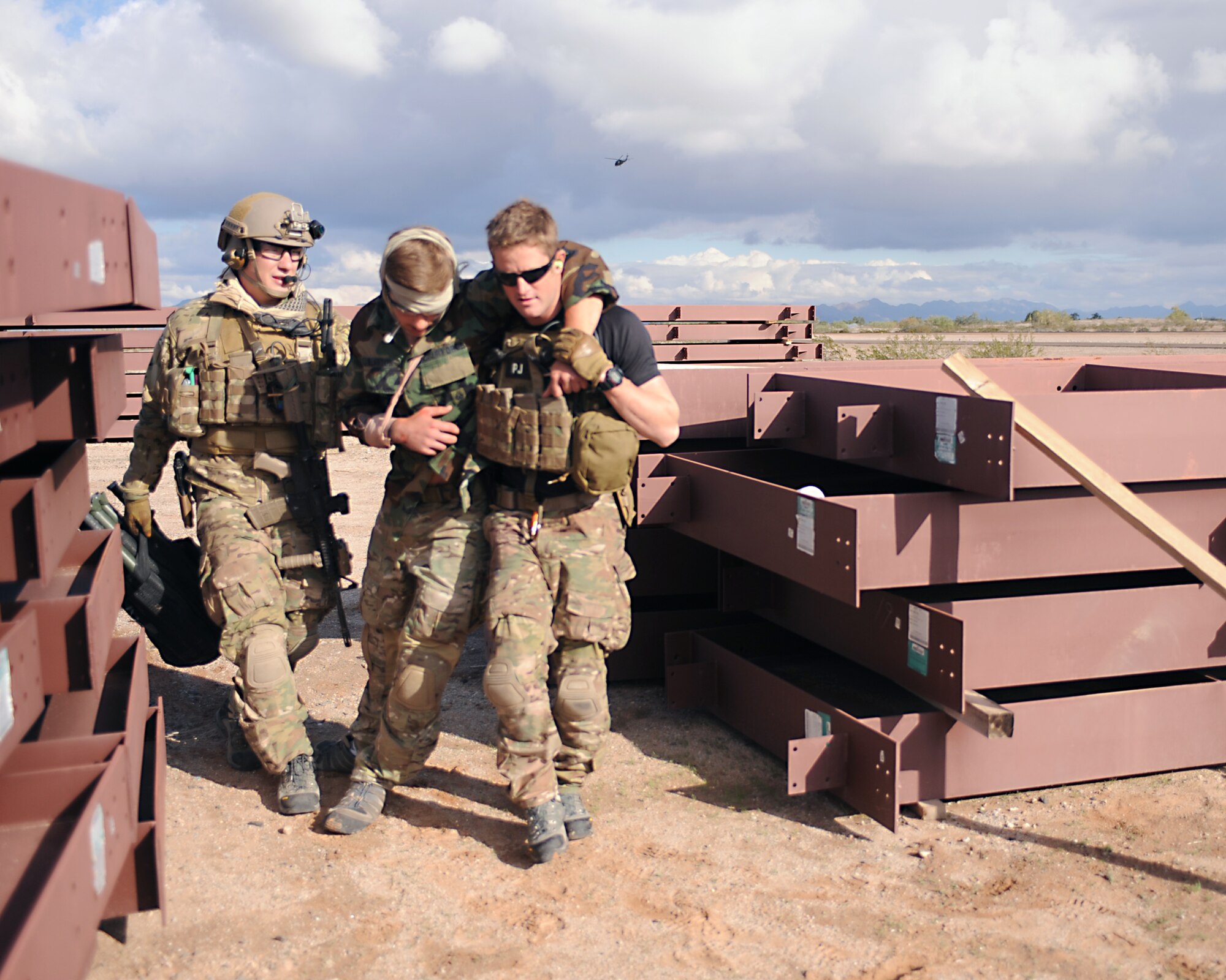 U.S. Air Force pararescuemen aid moulaged augementees during the Operation Shocker exercise at Gila Bend Air Force Auxiliary Field, Ariz., Dec. 14, 2011. (U.S. Air Force photo by Airman 1st Class Christine Griffiths/Released)