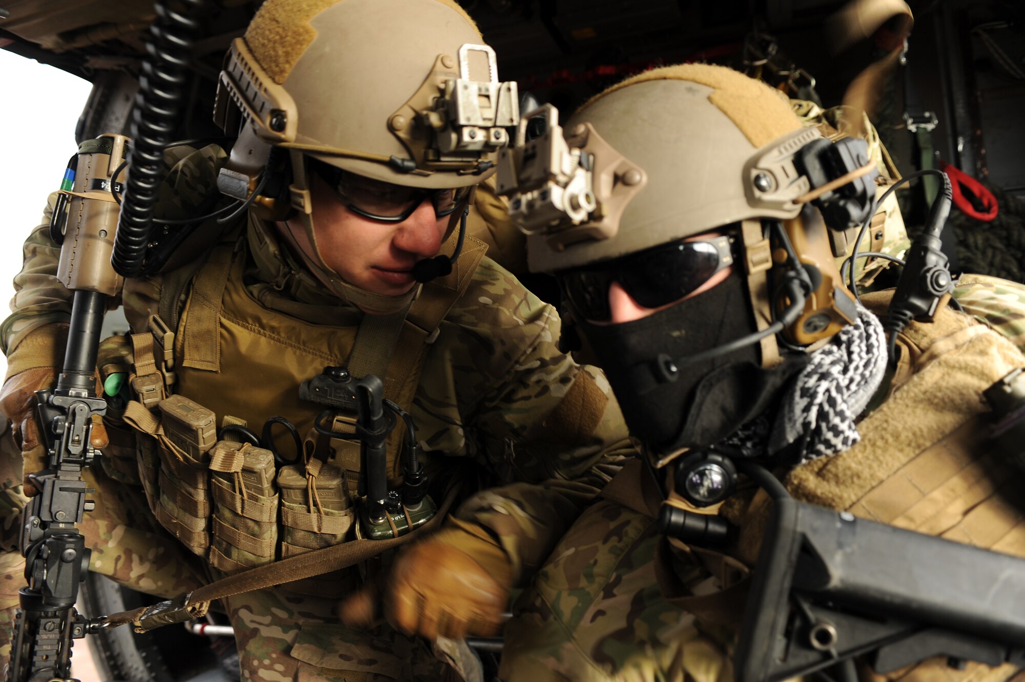 Two U.S. Air Force pararescuemen discuss their plan of action during the Operation Shocker exercise at Gila Bend Air Force Auxiliary Field, Ariz., Dec. 14, 2011. (U.S. Air Force photo by Airman 1st Class Christine Griffiths/Released)