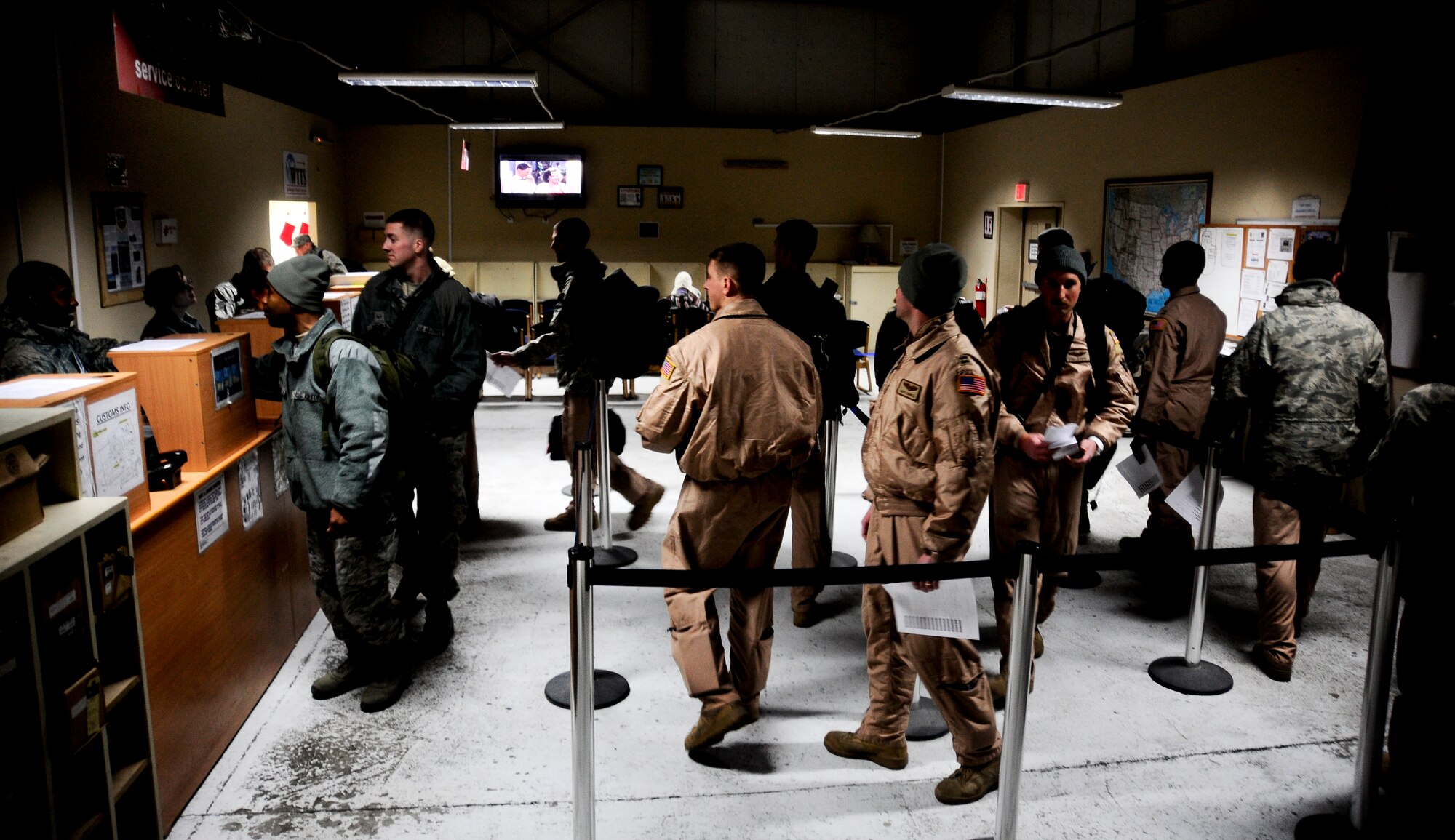 Airmen process through the passenger terminal Jan. 3, 2012 at the Transit Center at Manas, Kyrgyzstan. The Passenger terminal processes approximately 800 passengers a day and is responsible for all inbound and outbound passengers of International efforts in Afghanistan. (U.S. Air Force Photo/Staff Sgt. Angela Ruiz)