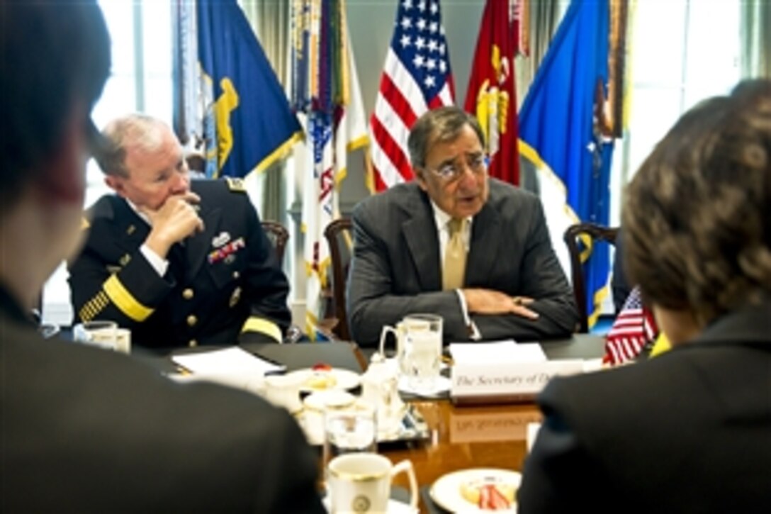 U.S. Defense Secretary Leon E. Panetta speaks with Lithuanian Defense Secretary Rasa Jukneviciene, right foreground, at the Pentagon, Jan. 4, 2012. Panetta and Jukneviciene met to discuss bilateral defense issues and the continuing partnership between the United States and Lithuania.