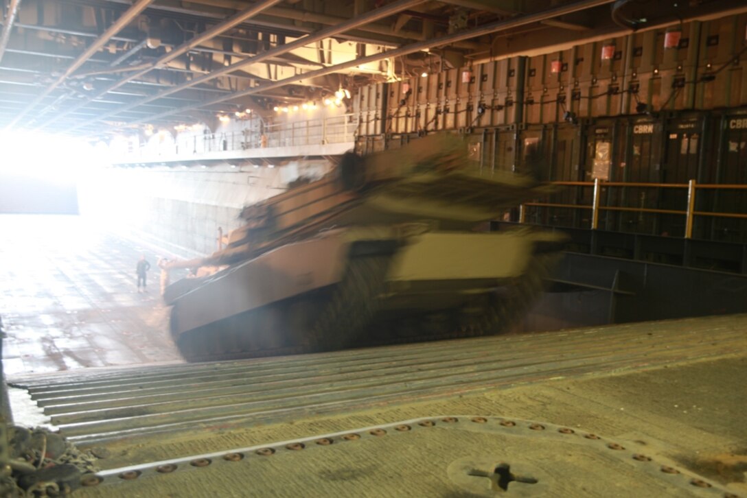 An M1A1 Abrams tank belonging to the 11th Marine Expeditionary Unit (MEU) moves in the well deck of USS Makin Island (LHD 8).  The unit is currently deployed as part of the Makin Island Amphibious Ready Group (MKIARG), serving as a U.S. Central Command theater reserve force.  The group is also providing support for maritime security operations and theater security cooperation efforts in the U.S. 5th Fleet area of responsibility.