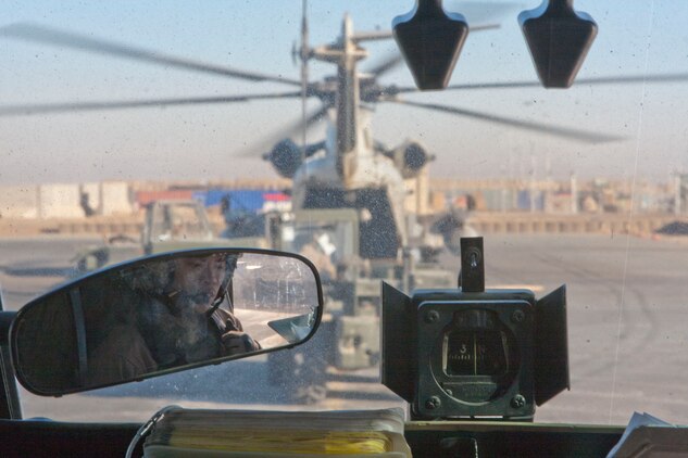 U.S. Marine Corps Capt. Viet Tran, pilot, Marine Heavy Helicopter Squadron 363 (HMH-363), reviews the flight operation itinerary, Camp Bastion, Helmand Province, Afghanistan, Jan. 5, 2012. HMH-363 conducted flight operations in support of troops throughout the Helmand Province. (U.S. Marine Corps photo by Lance Cpl. Robert R. Carrasco/Released).