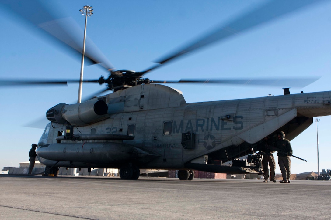 U.S. Marines of Marine Heavy Helicopter Squadron 363 (HMH-363) conduct an end of day assessment on a CH-53D Sea Super Stallion, Camp Bastion, Helmand Province, Afghanistan, Jan. 5, 2012. End of day assessments are conducted after flight operations ensuring aircraft of HMH-363 are ready to support future missions. (U.S. Marine Corps photo by Lance Cpl. Robert R. Carrasco/Released).