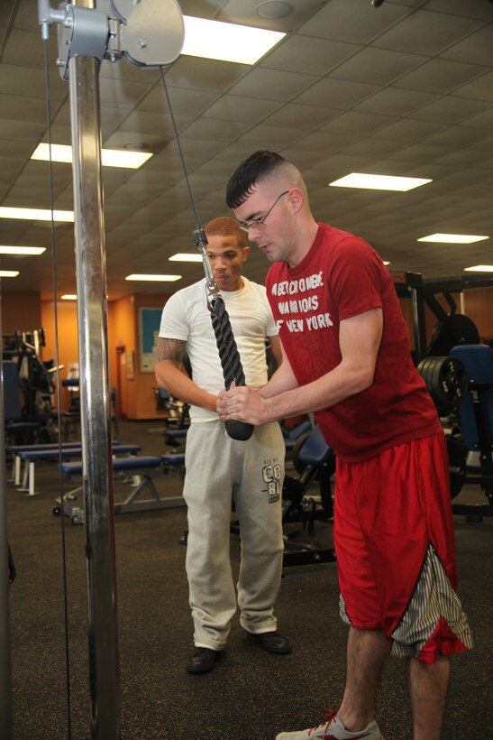 Pfc. Wesley Jordan, an aircraft maintenance administration specialist with Marine Heavy Helicopter Squadron 366, works out his triceps on one of the new machines at the Marine Corps Air Station Cherry Point Devil Dog Gym equipment Jan. 5. The Devil Dog Gym received approximately 50 new pieces of equipment for the gym.