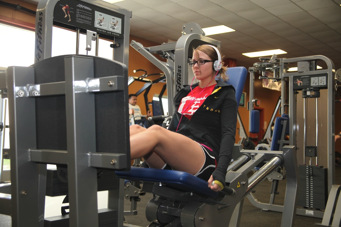 Cpl. Lyssa Bucklew, an aircraft maintenance administration specialist with Marine Heavy Helicopter Squadron 366, works out her legs on one of the new pieces of the Marine Corps Air Station Cherry Point Devil Dog Gym equipment Jan. 05. The gym received pieces of equipment for both in the gym and the cardio room for the service members of the Air Station to use.